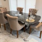 Table céramique Florence 240 cm — gris italien, pieds papillon bronze